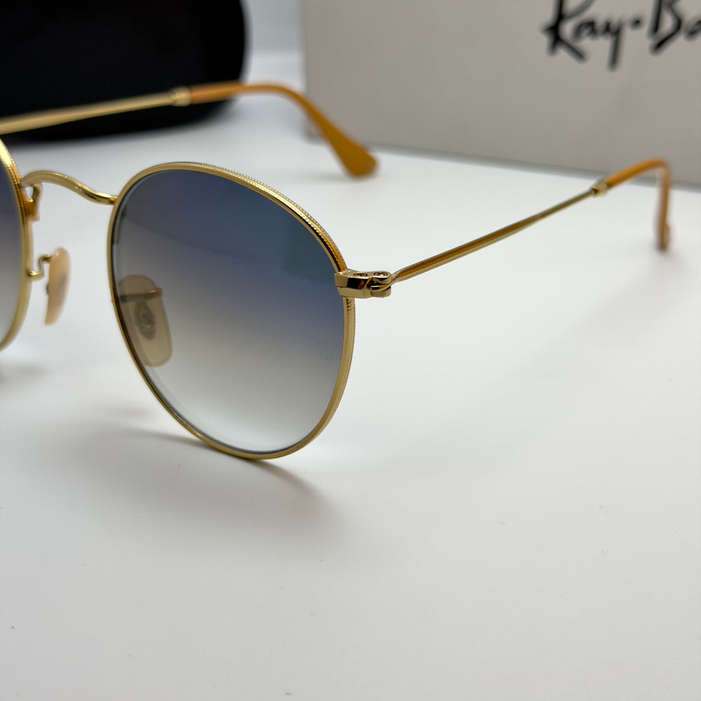 Ray-Ban Round Metal RB3447 – Or & Verres Minéraux Bleu Dégradé